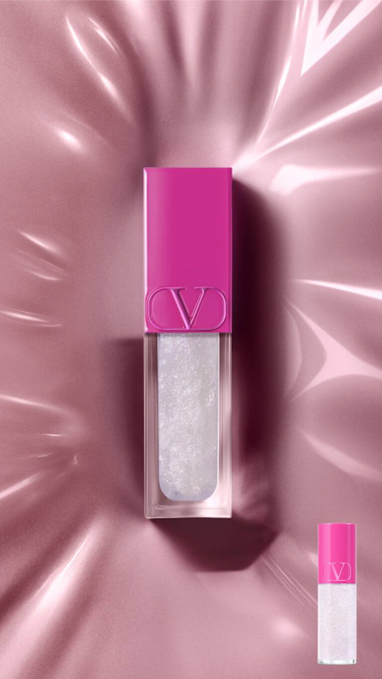 lip gloss with a fuchsia pink cap and shimmering white gloss stands on a reflective pink surface with light reflections. A smaller version is in the bottom right..